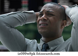 Stressed businessman at stock exchange