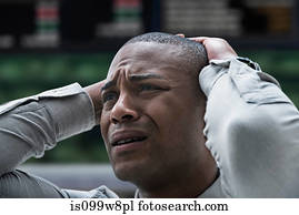 Stressed businessman at stock exchange