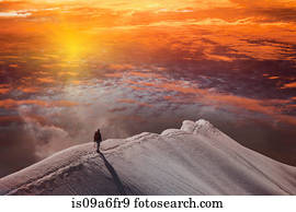 Person on mountain at sunset, Piz Palu, St Moritz, Canton Graubunden, Switzerland