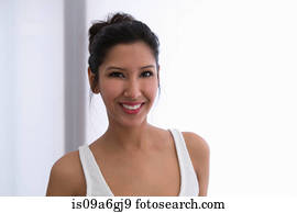 Portrait of young woman wearing white vest