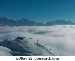 Ski lifts in ski resort with low cloud
