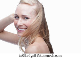 Young woman with hand in hair