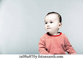 Portrait of baby boy wearing striped top looking away
