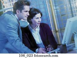 Business couple at computer