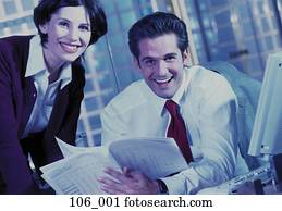 Business couple reading