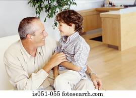 Grandad with grandson on his lap