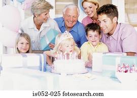Girl blowing out candles
