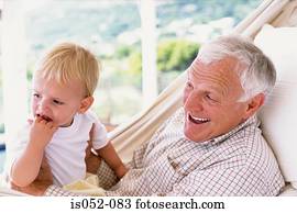 Grandad with grandson in a hammock