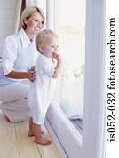 Toddler and mum looking out a window