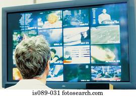 Man looking at televisions Man looking at televisions