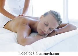 Woman receiving back massage Woman receiving back massage
