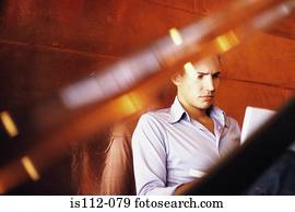 Man doing personal work in bar