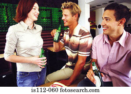 Men and woman having drink at bar