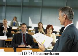 Businesspeople being lectured