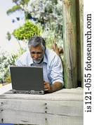 Man outside with computer