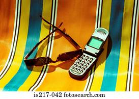 Deckchair, sunglasses and mobile phone