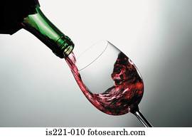 Red wine poured into glass