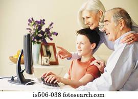 Grandparents and grandson using computer