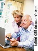 Man and woman using laptop computer