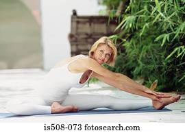 Woman doing yoga outdoors