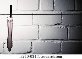 Condom hanging on clothesline