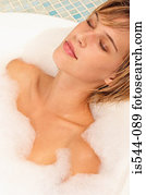 Young woman relaxing in bubble bath