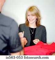 Man buying clothes with credit card