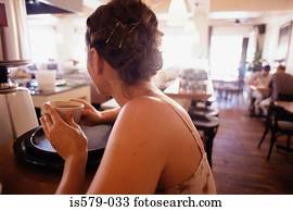 Young woman having coffee