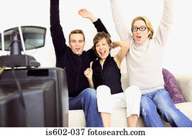 People celebrating on sofa