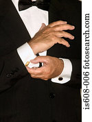 Senior man adjusting cuff links