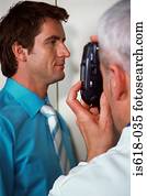 Doctor photographing patient