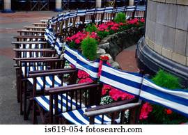 Deckchairs near column