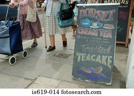 Senior women walking near cafe Senior women walking near cafe