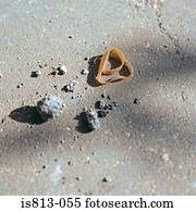 Rubber band and rubble on floor
