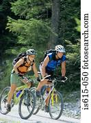 Two cyclists riding together.