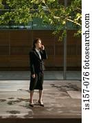 Businesswoman using cellular telephone