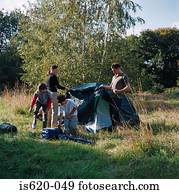Family erecting a tent