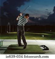 Man practising on driving range