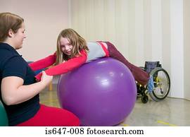Girl exercising on fitness ball