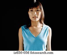 Young asian woman in blue vest