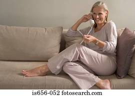 Woman on phone holding credit card