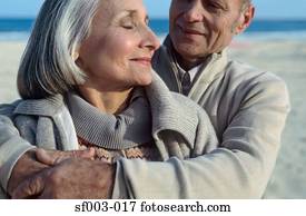 Senior couple hugging on beach