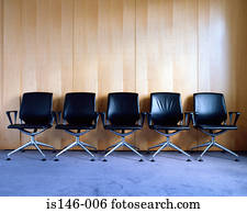 Row of empty office chairs
