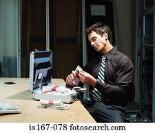 Man counting bundles of money