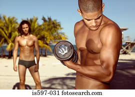 Man exercising on beach