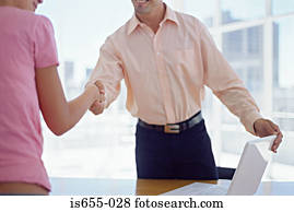 Man and woman shaking hands