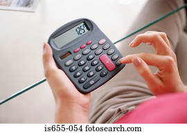 Woman using calculator