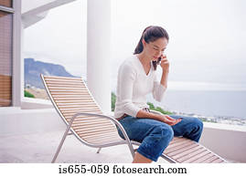 Woman using credit card over the phone