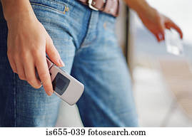 Woman with mobile phone and credit card