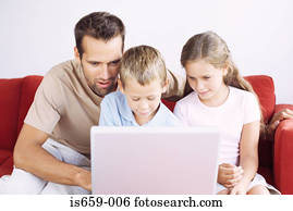 Father and children using laptop